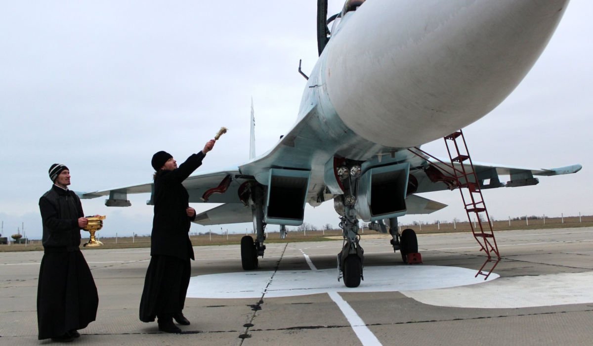 False religion blessing war plane