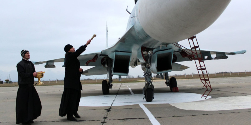 False religion blessing war plane (1)