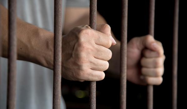 Hands of the prisoner in jail