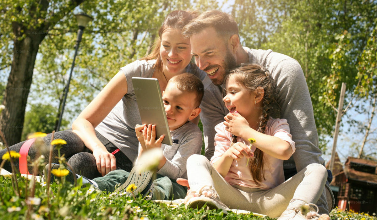 happy families enjoying a day in a park