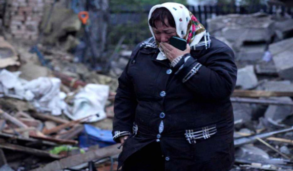 resident cries standing amid the rubble of her house ruined after Russia's air attack in Khmelnytskyi region, Ukraine, Sunday, May 25, 2025. (Ukrainian Emergency Service via AP)