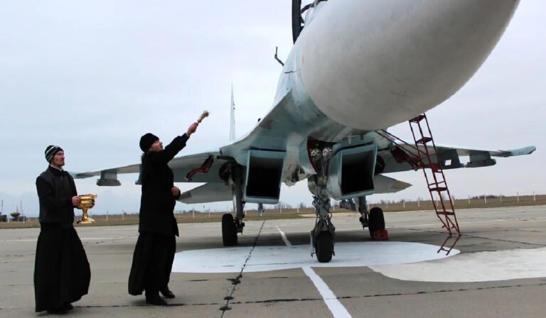 Priest blessing fighter jet